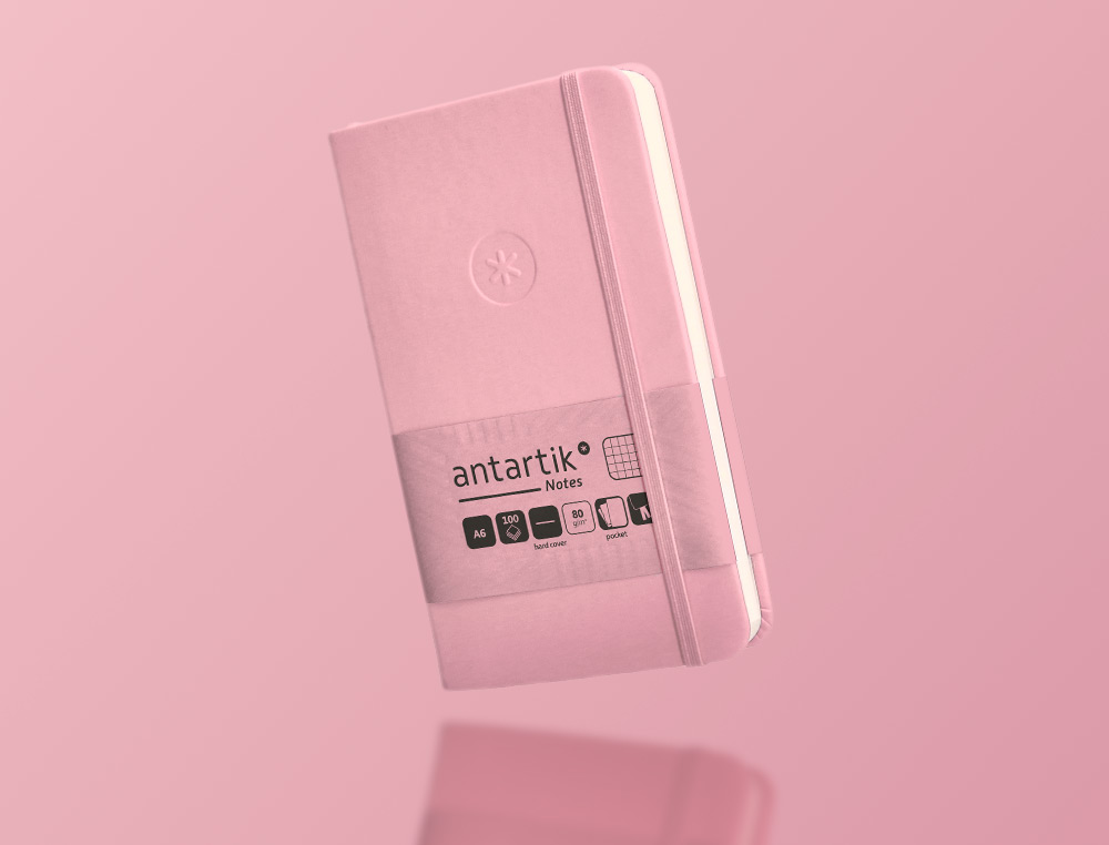 CUADERNO CON GOMILLA ANTARTIK NOTES TAPA DURA A6 HOJAS CUADRICULA ROSA PASTEL 100 HOJAS 80 GR FSC